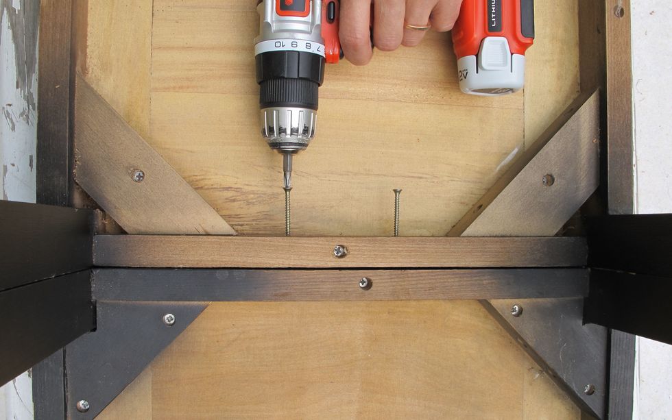 Screw both chairs together by the legs and seat to make them steady.