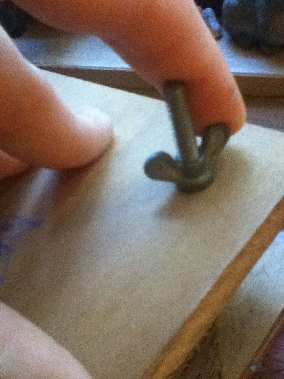 Screw each screw up, going diagonally.