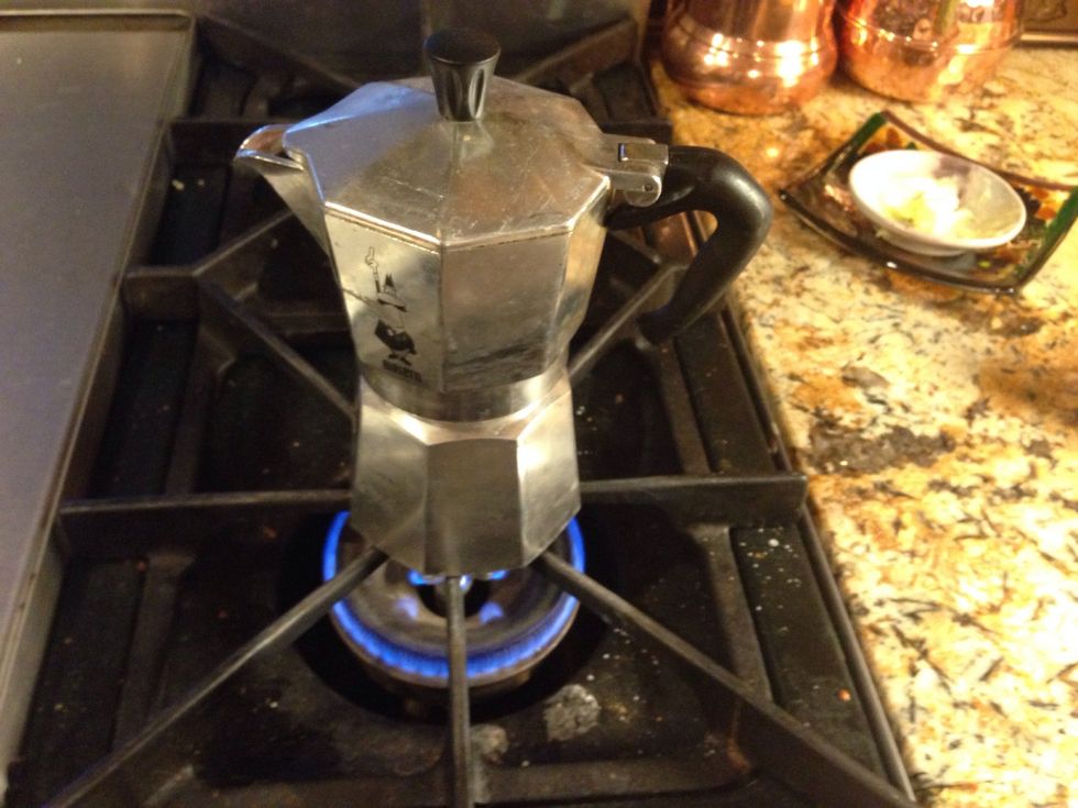 Screw on lid, and let boil. Espresso will bubble up into the top section of the espresso maker. In about 4 minutes the process will be finished.