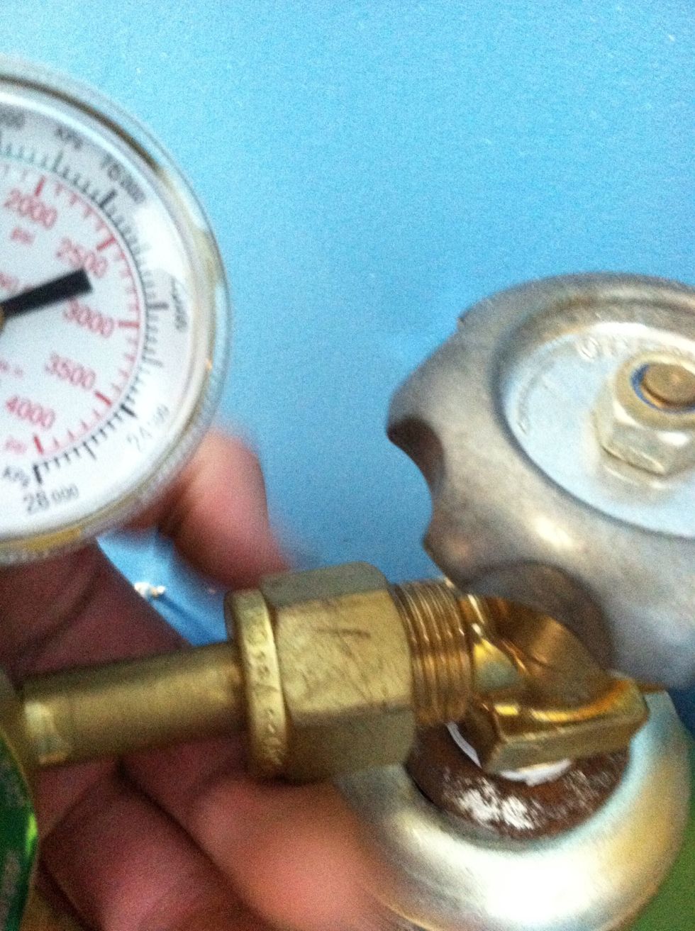 Screw on the regulator finger tight