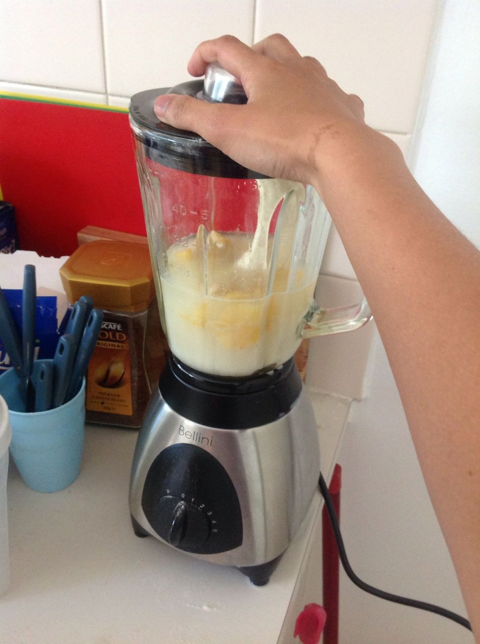 Screw the lid into the blender, making sure it's secure.