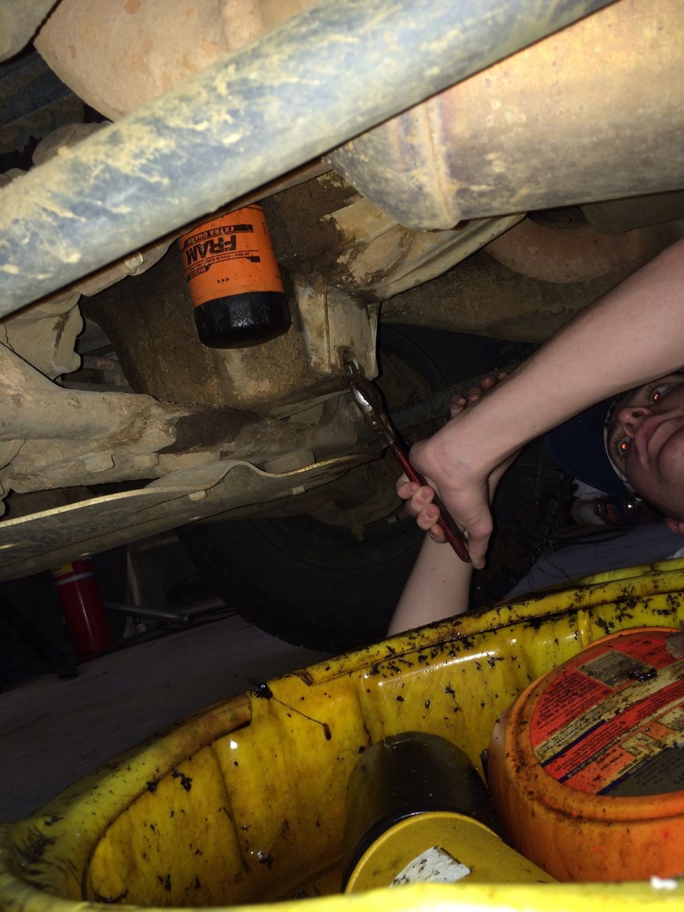 Screw the oil plug back on