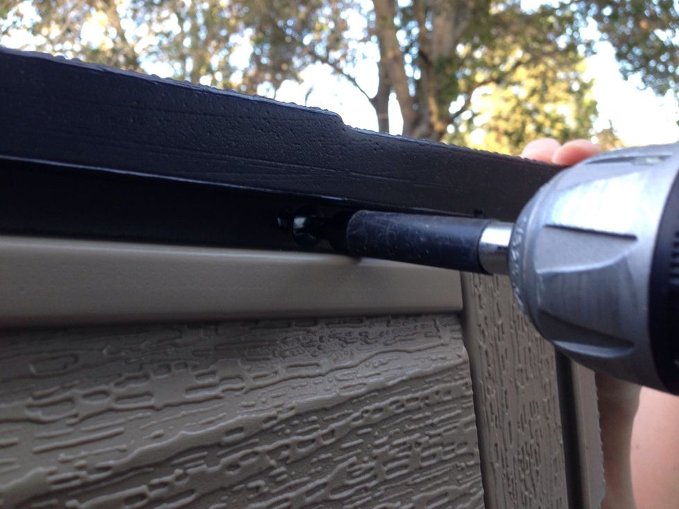 Screw the roof into the back walls through the pilot holes drilled in Step 5.