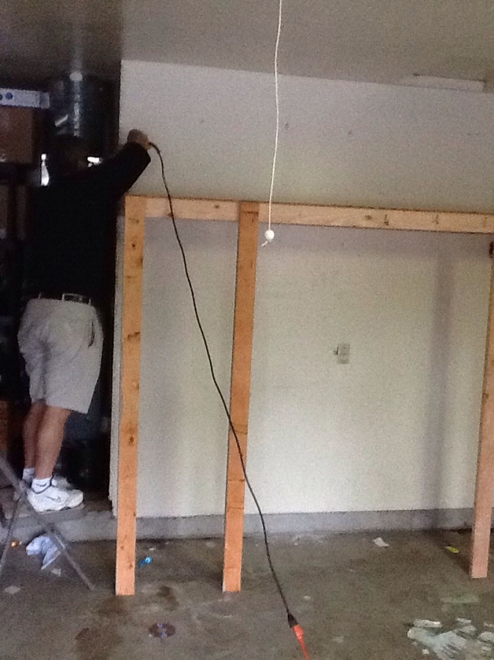 Screw the top shelf into the original stud you placed on the wall. Making sure its flush to both ends.