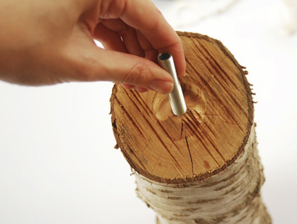 Screw threaded tube into the hole