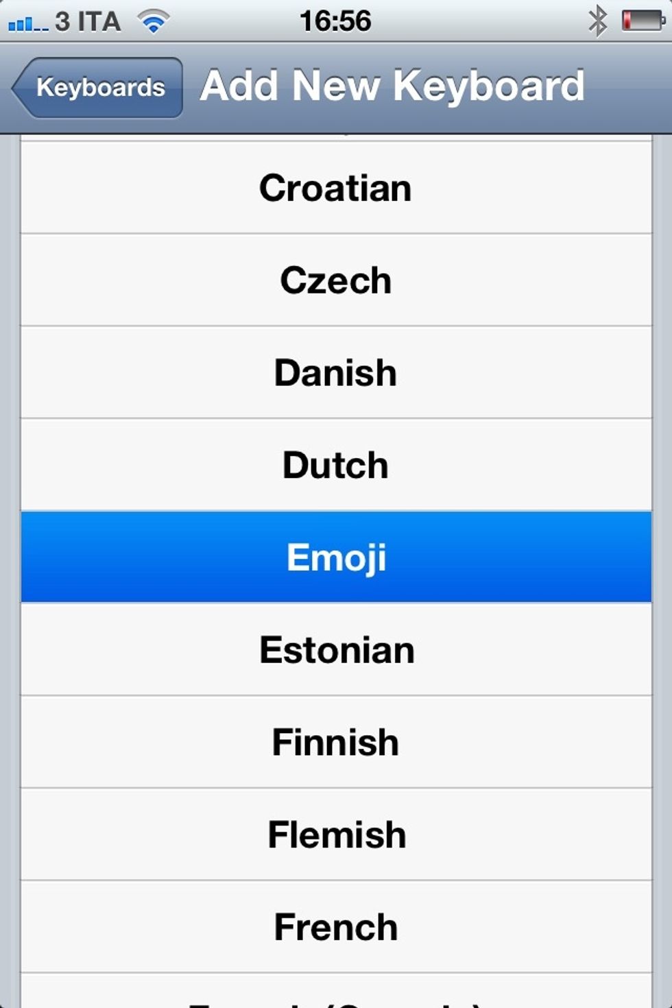 Scroll the languages and tap on Emoji
