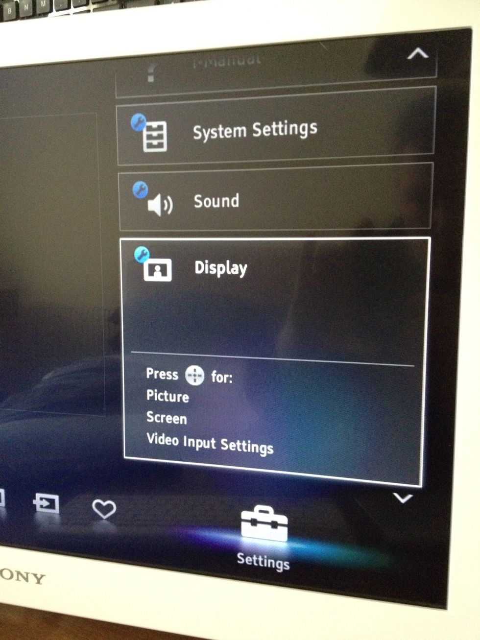 Scroll up until you get to the display settings. Press the centre button to select those settings.