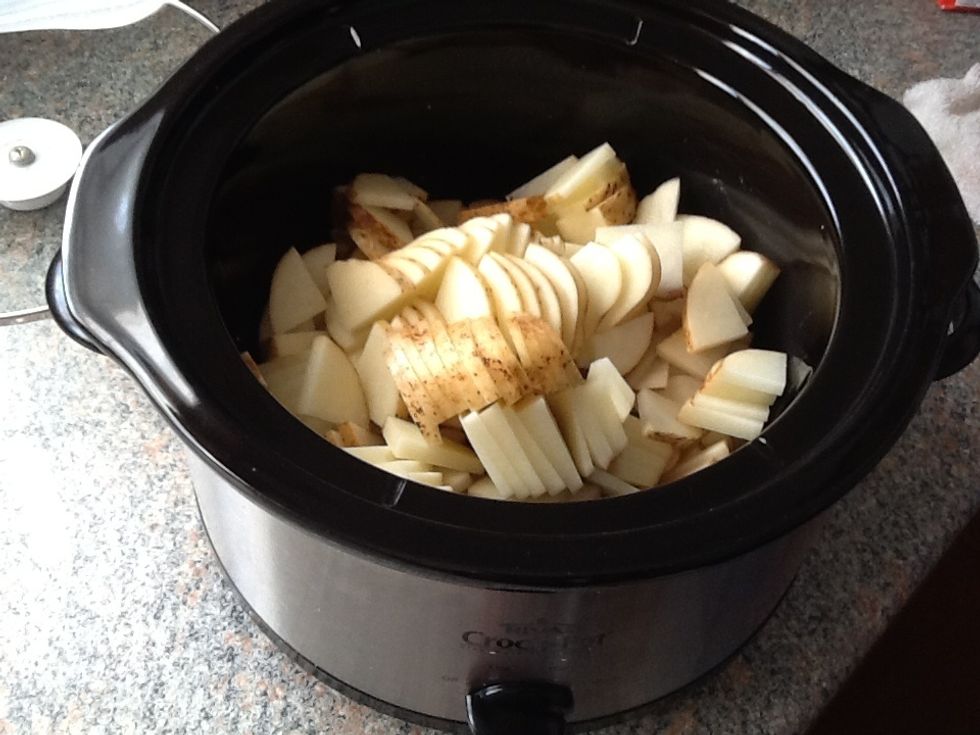 Scrub and chop your potatoes and place them into the crock-pot.