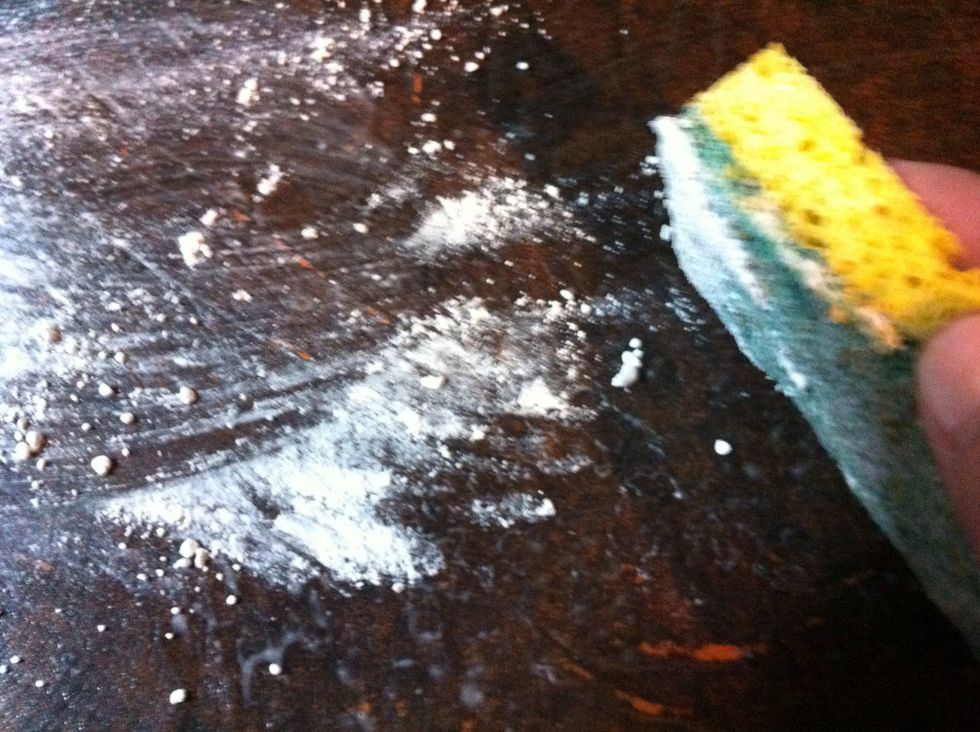 Scrub the counter with scrubber sponge.