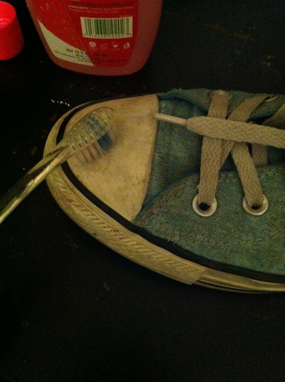 Scrub the toe and sole, reapplying the nail polish remover as needed