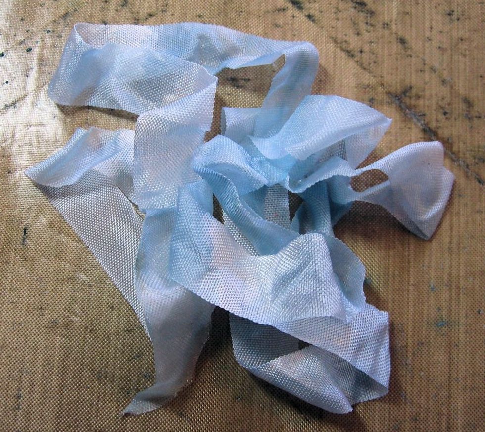 Scrunch the ribbon to move the ink all through the fibers. Gently dry with heat gun. Tie into a multi loop bow. I use a Zutter Bow it All tool to tie all my bows.