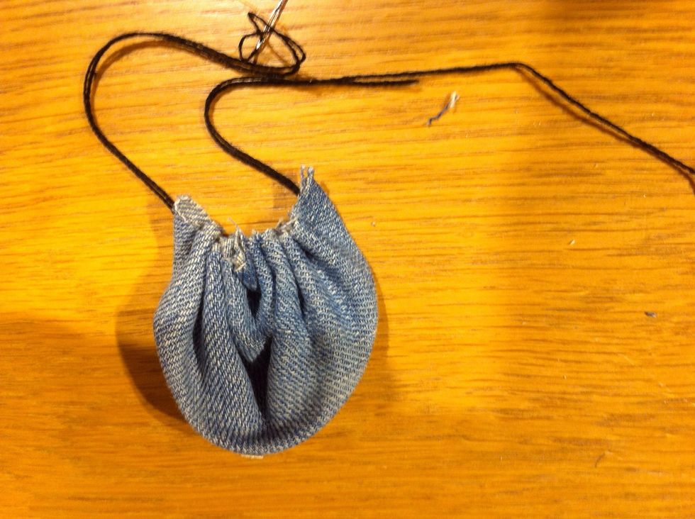 "Scrunch" up. You can do several of them separate or leave needle on the thread and do them together.