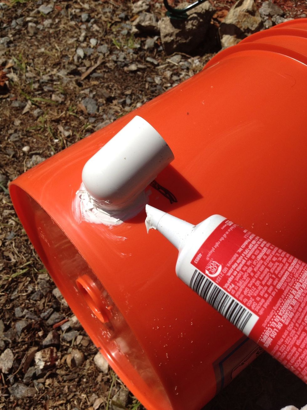 Seal around the edges with waterproof plumber's caulk. Set this aside and let it dry. It could take about two hours to dry depending upon the weather.