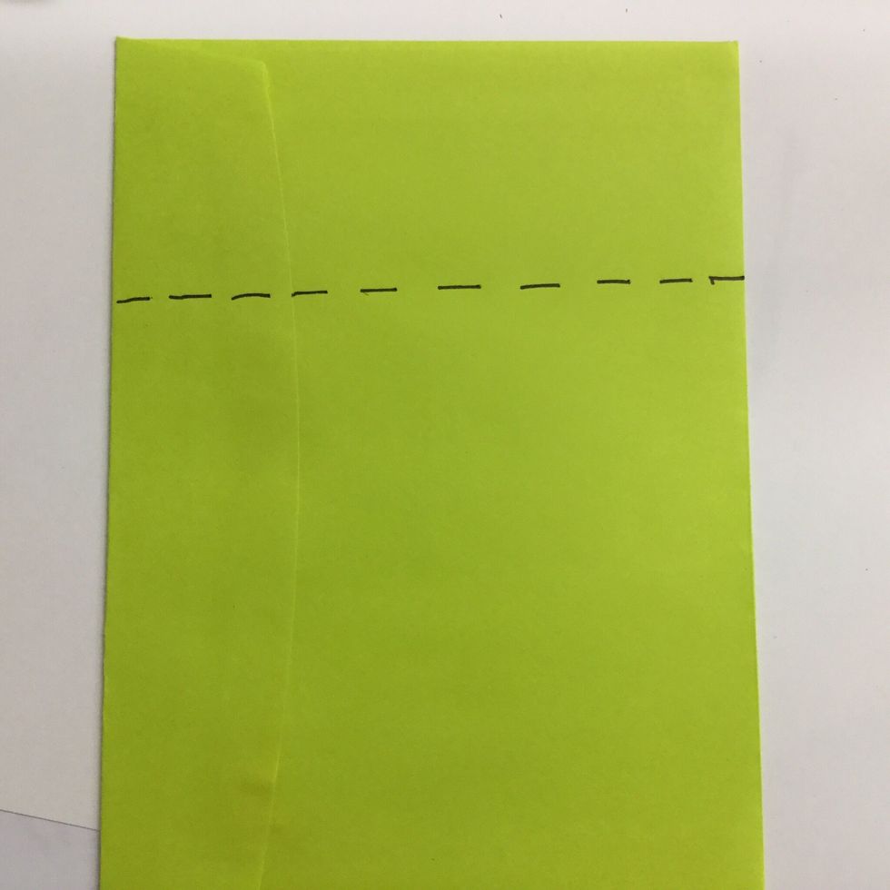 Seal the envelope. You need to cut it into a square. Measure the width, then draw a cutting line that far from one of the short ends of the envelope.