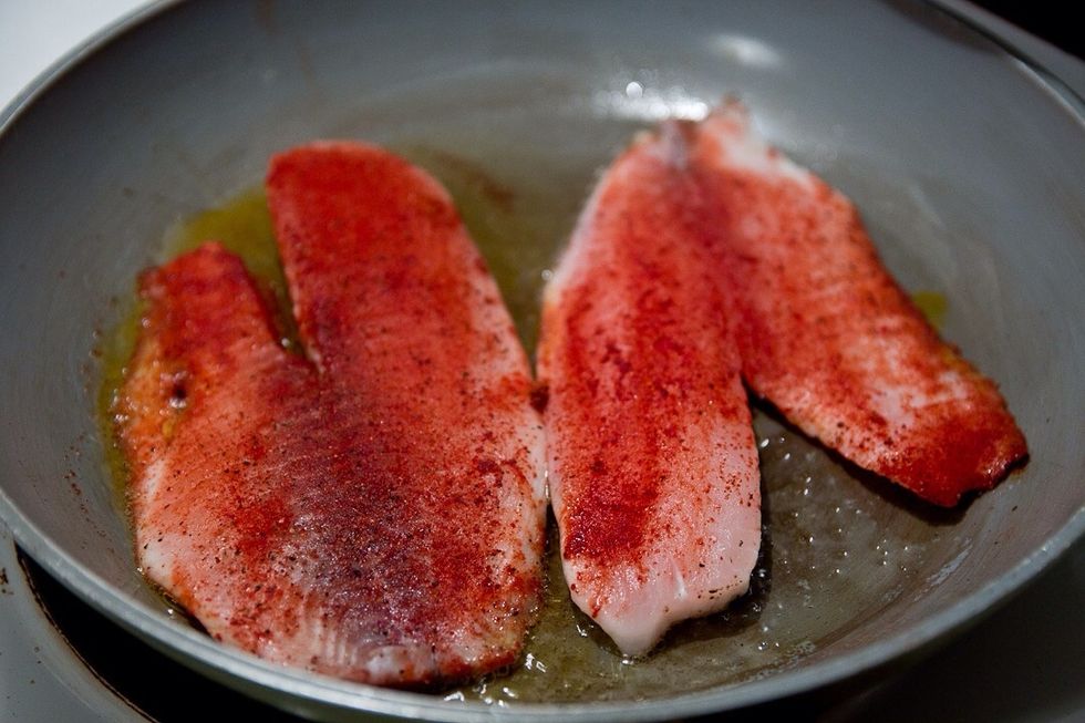 Sear over medium high heat. Very important that the pan is hot before adding the fish! Carefully add the fish with the pan tilted away from you, so the oil doesn't splash.