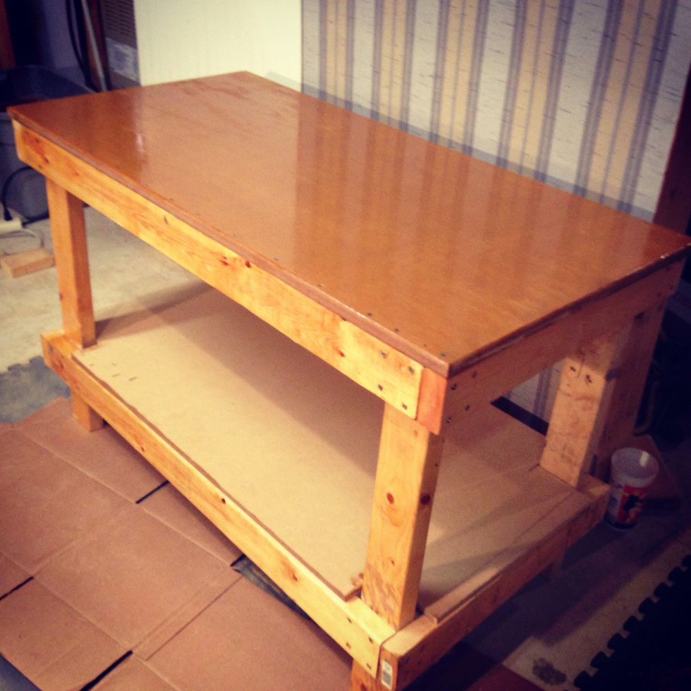 Search Internet for free plans for work bench, this bench was created from free plans. Depending on your materials selected and what you already have I would be around $25-$40. They sell for over $200