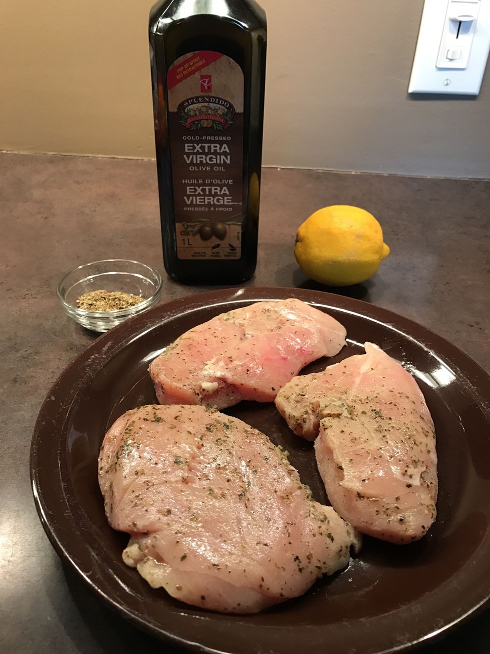 Season and prepare chicken breasts for the oven