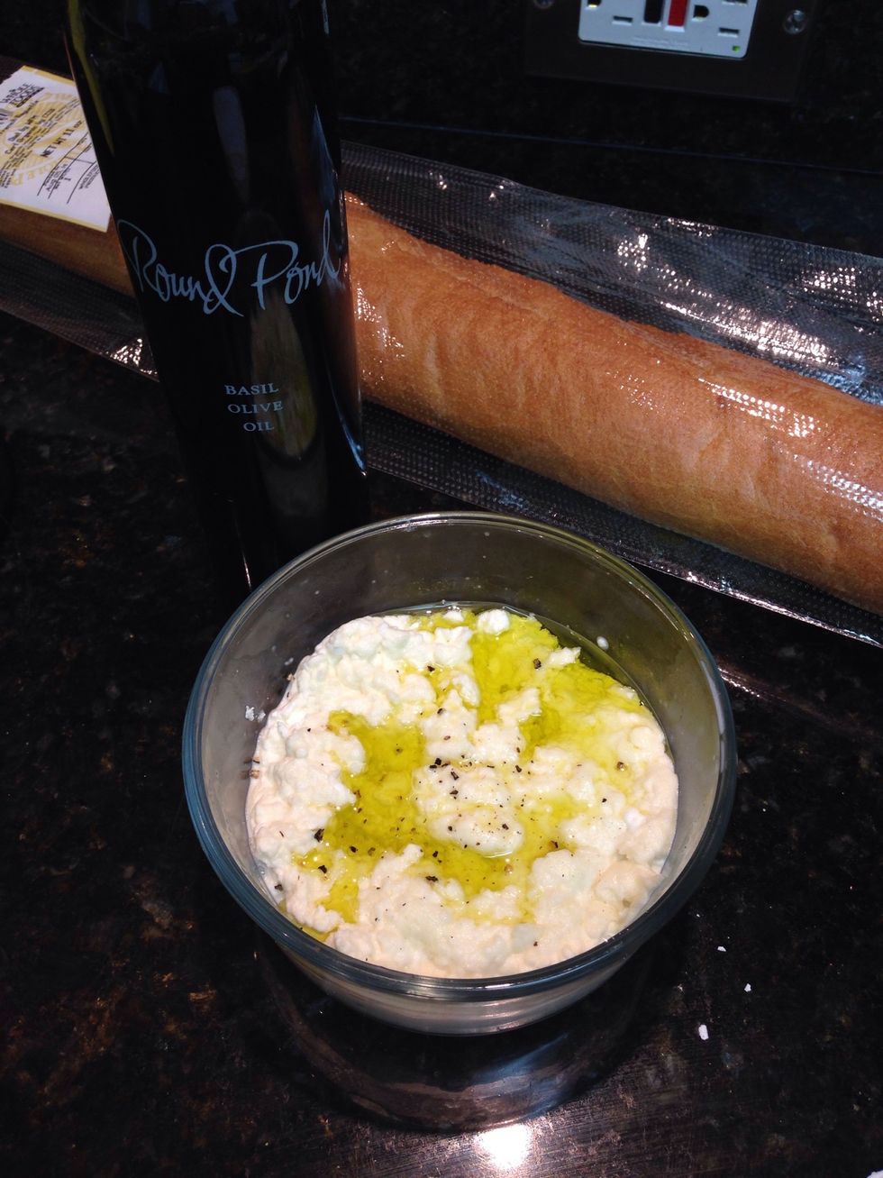 Season as you please. I like salt, pepper, and a drizzle of good olive oil and serve with baguette or crostini. To make a creamier cheese, beat in a few tablespoons of heavy cream. Enjoy!