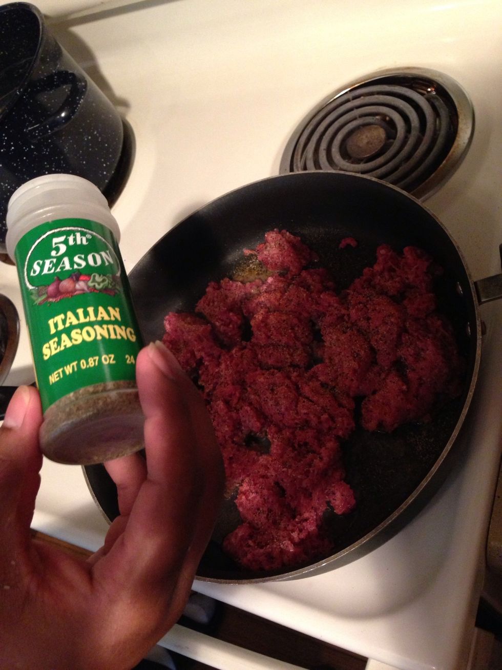 Season beef while browning