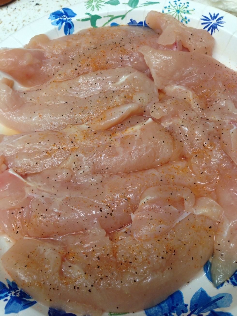 Season both sides of the chicken breast.