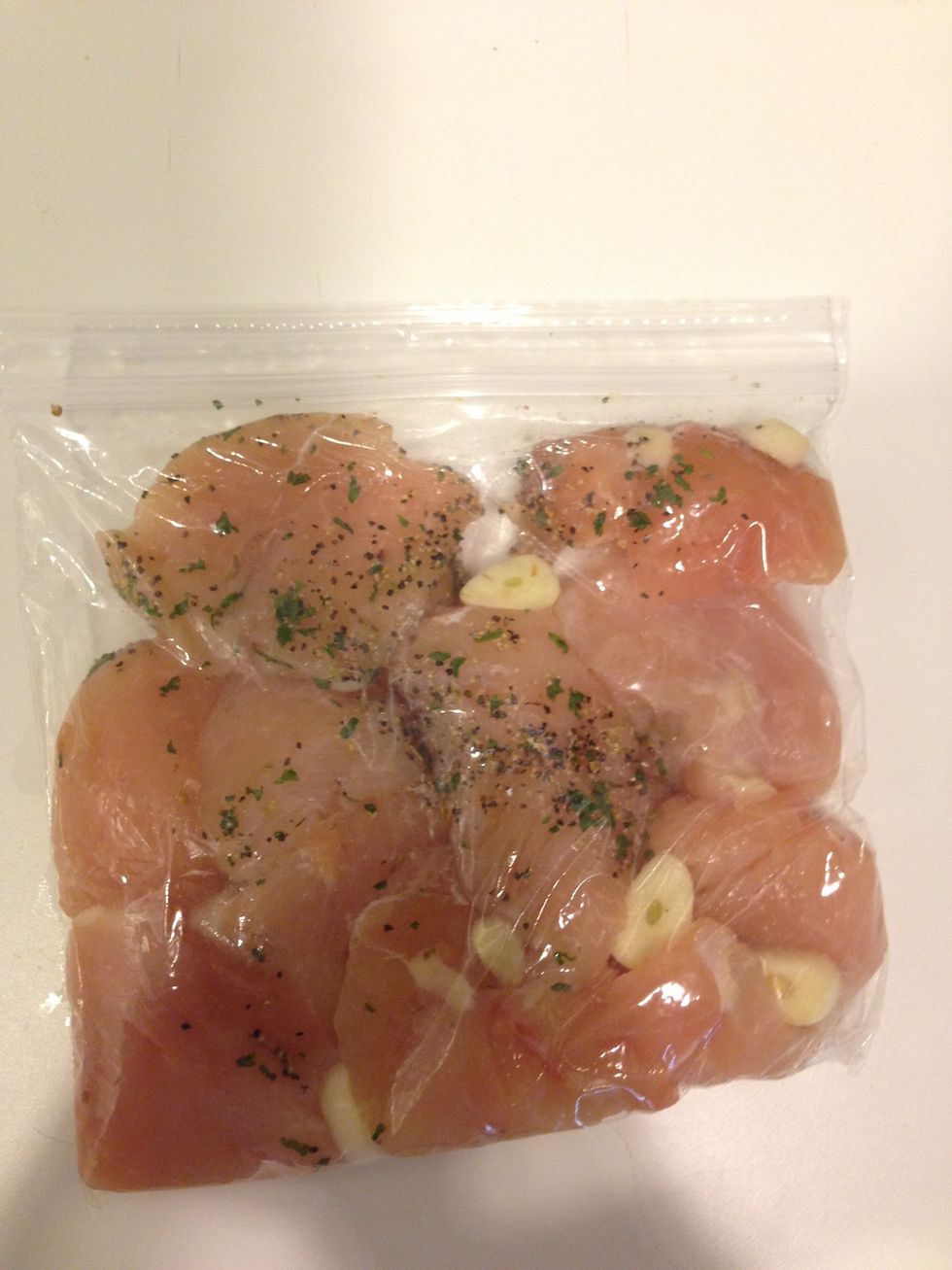 Season chicken with garlic, parsley, oregano, salt and pepper. Let sit in fridge for 30 minutes. If you do not have the time, that is ok it's not essential.