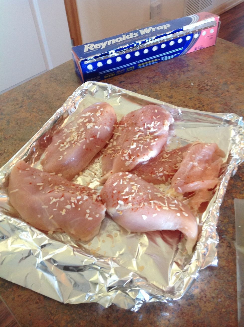 Season chicken with pepper, garlic salt, and onion flakes. Make sure to season both sides.