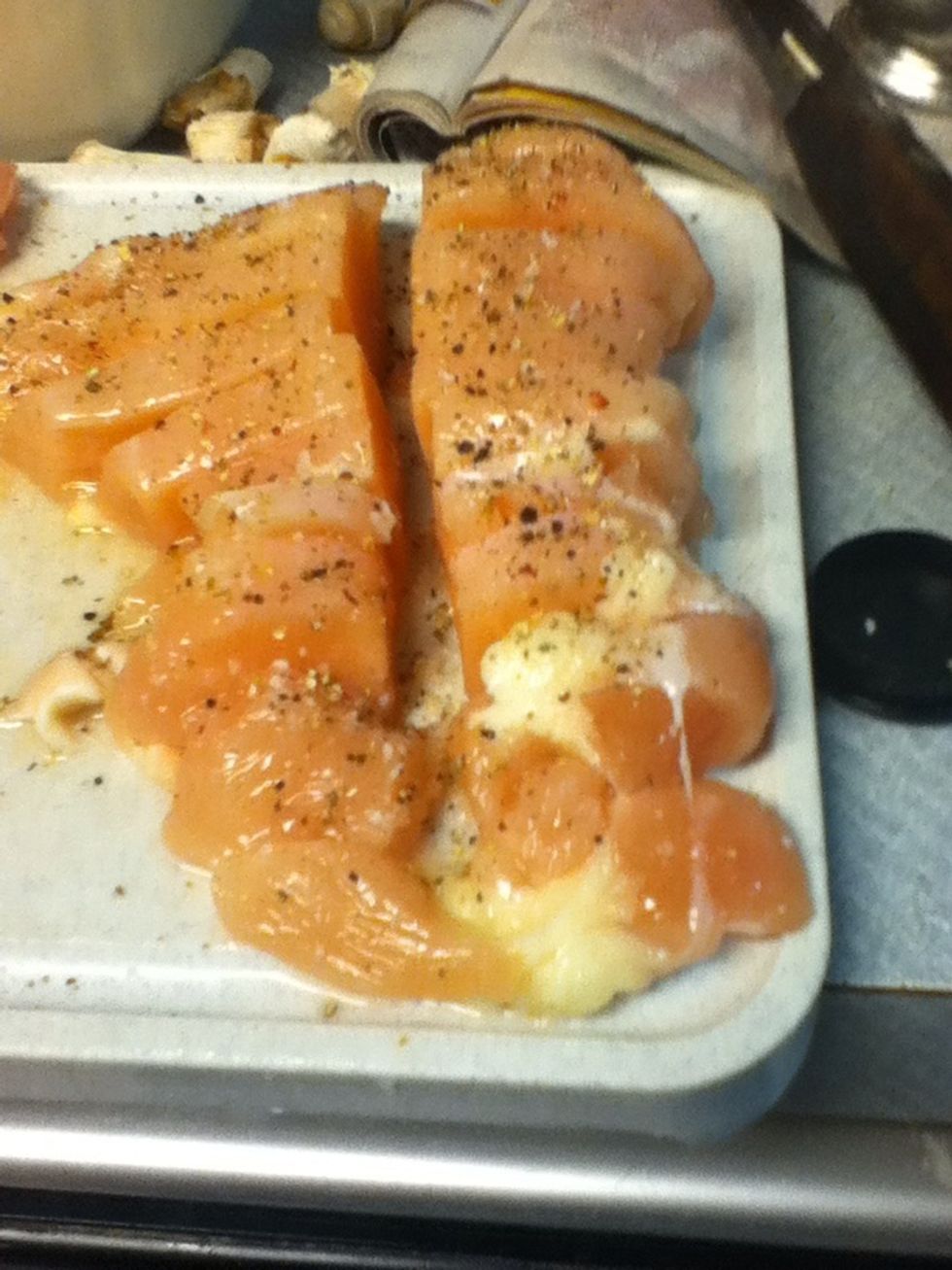 Season chicken with salt and pepper