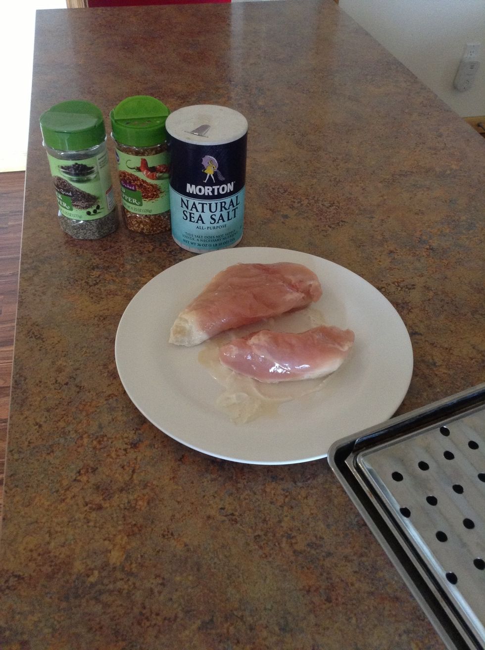 Season chicken with salt, pepper, and red pepper flakes. Be sure to place season side down on baking sheet ( use tongs to move chicken)