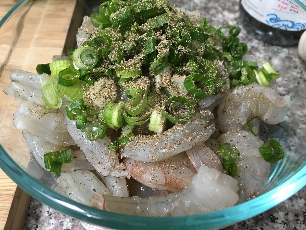 Season it with pepper and green onions.