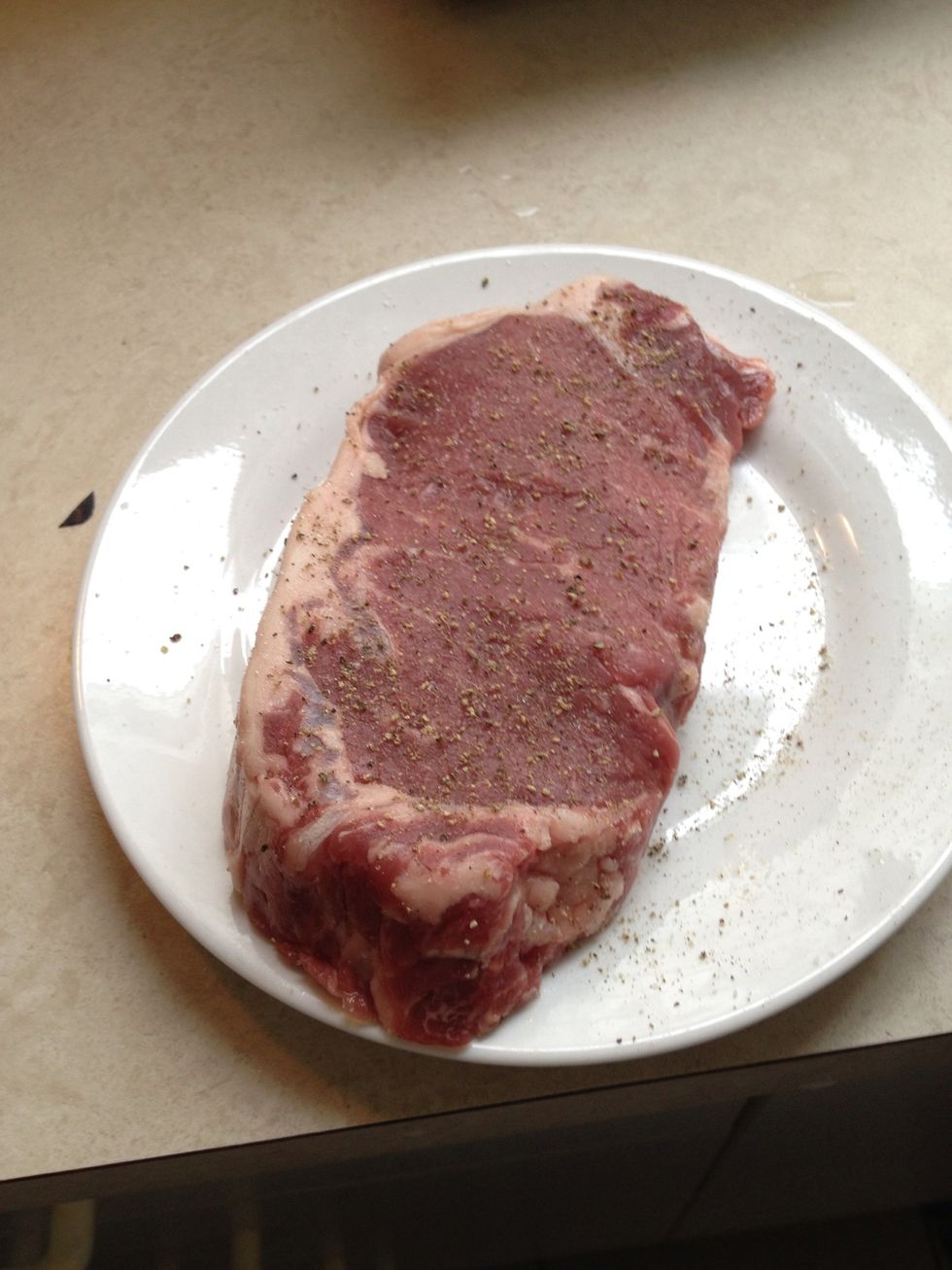 season liberally with salt & pepper (optional) place a few drops of oil onto meat and spread across