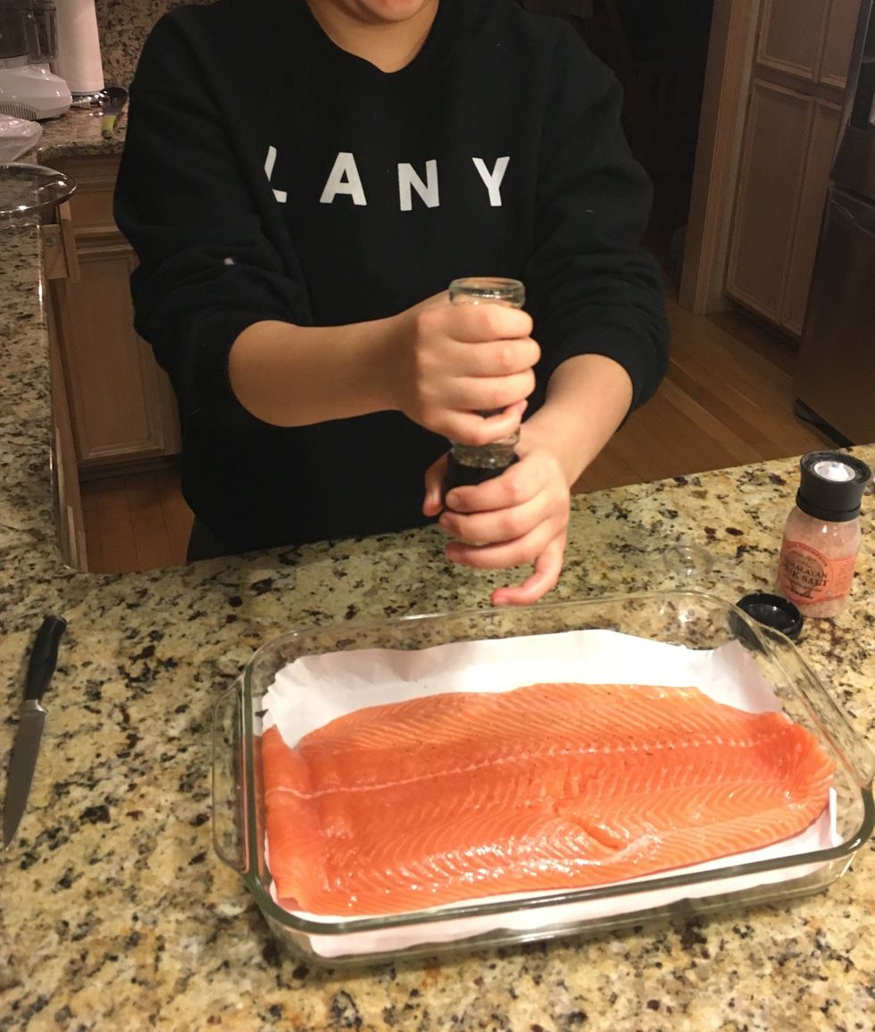 Season salmon fillet with salt and pepper, to taste.