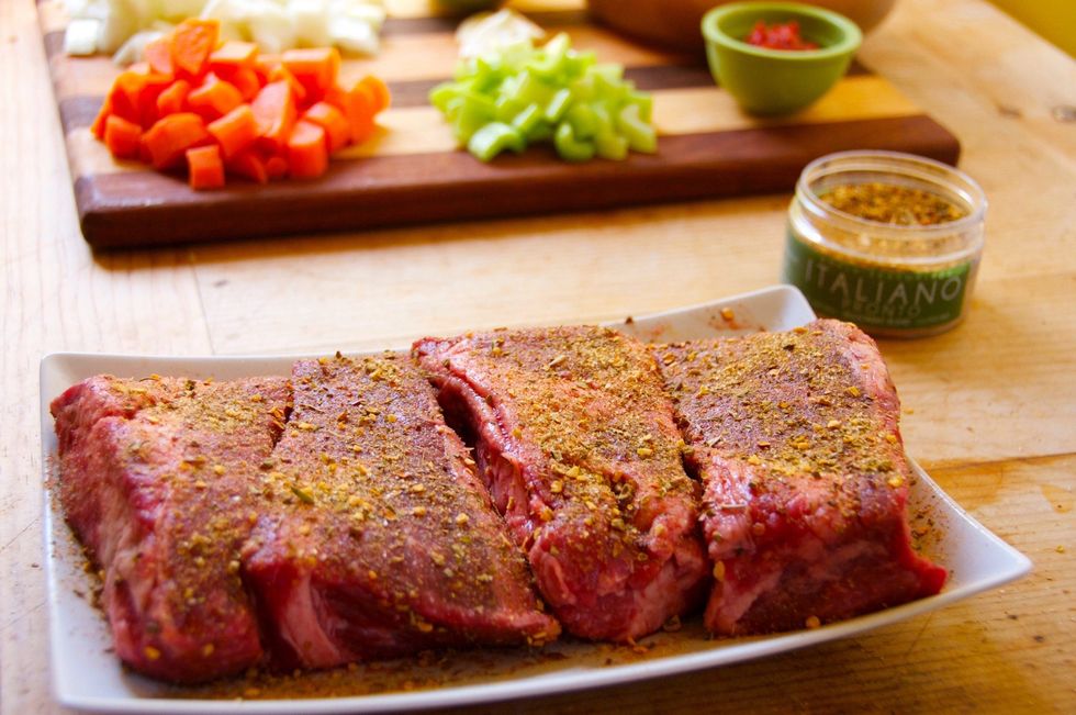 Season the meat with 1 TBSP Italiano Pronto.  Rub into the meat and let sit for 15 minutes or so.  Use the time to chop the onion, carrots and celery.