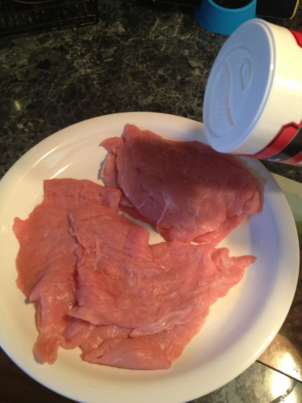 Season the veal cutlets with salt