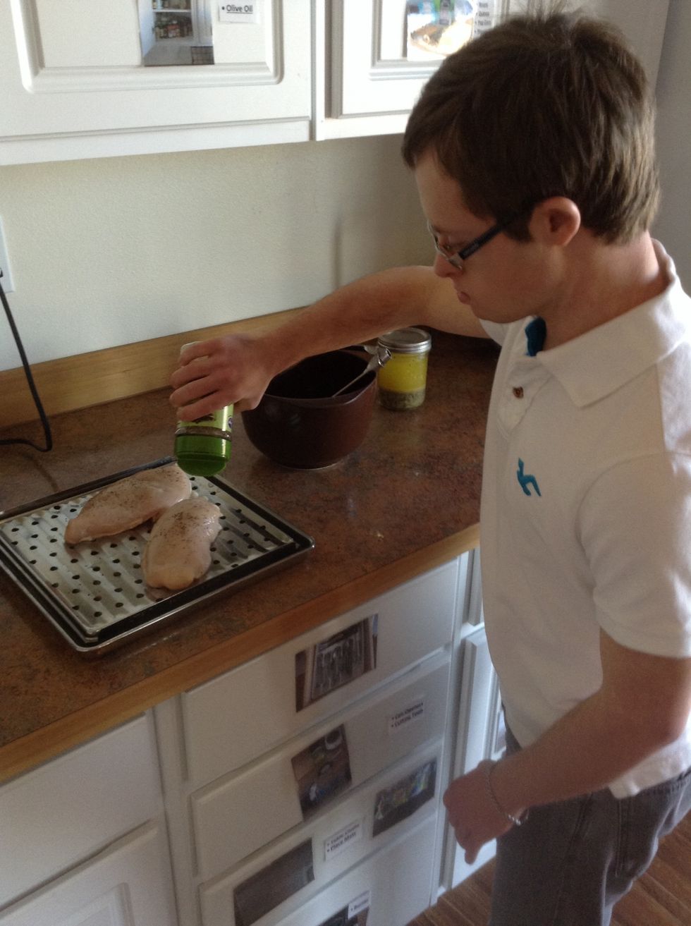 Season top side of chicken with salt, pepper, and onion flakes