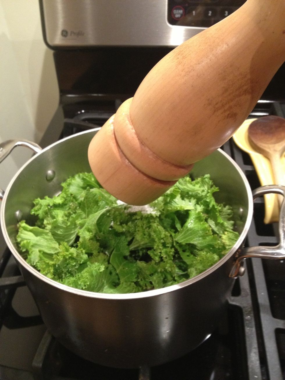 Season with pepper and then cook stirring often, until greens are wilted.