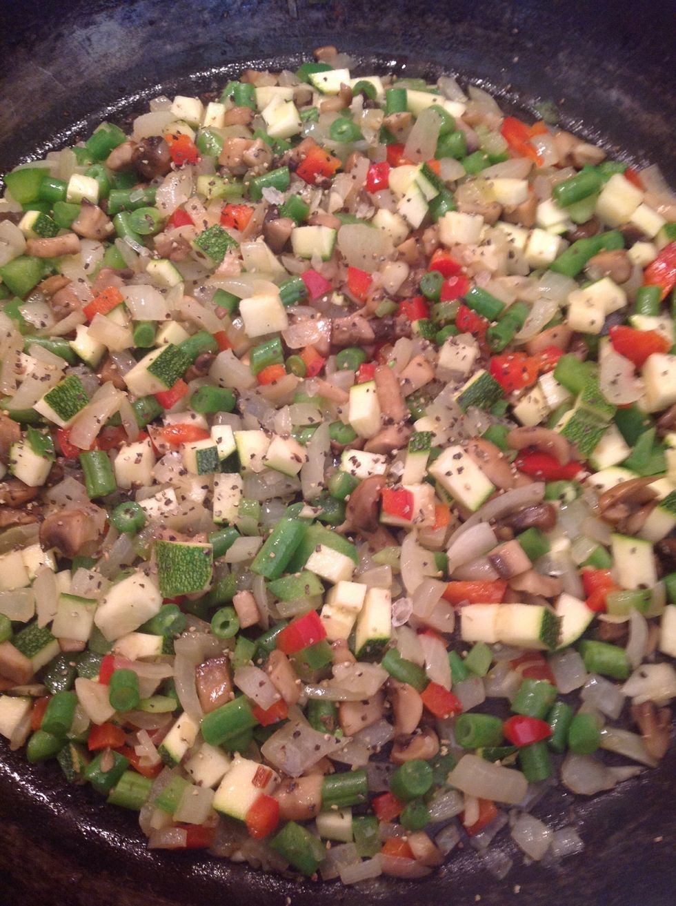 Season with salt and pepper and continue to cook on a medium to low heat, occasionally stirring for a few minutes.