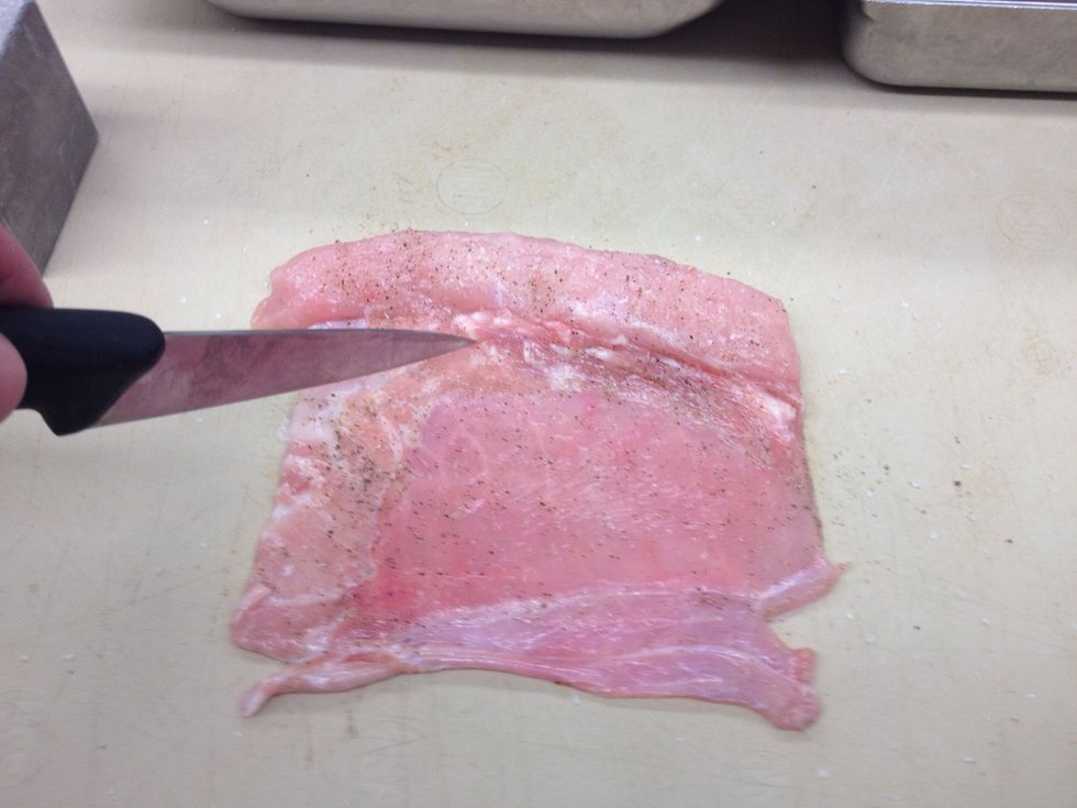 Season with salt and pepper and score belly in a crosshatch pattern, do not cut through.