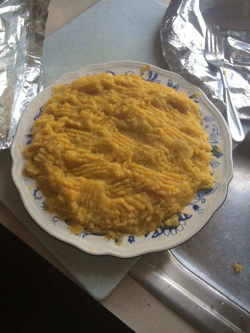 Season with salt (I prefer Lawry's) and mash. Set aside to cool (cover with aluminum foil