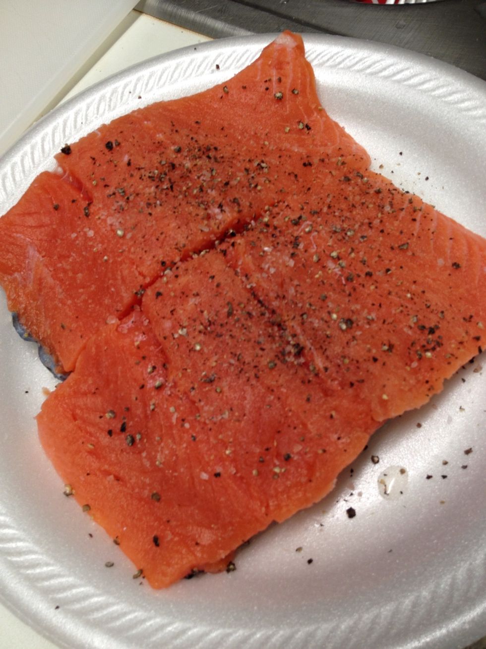 Season your salmon with black pepper and just a tiny bit of salt. Sometimes I don't even use salt in this step because the sauce flavors the fish well. There is also enough salt in the Parmesan.