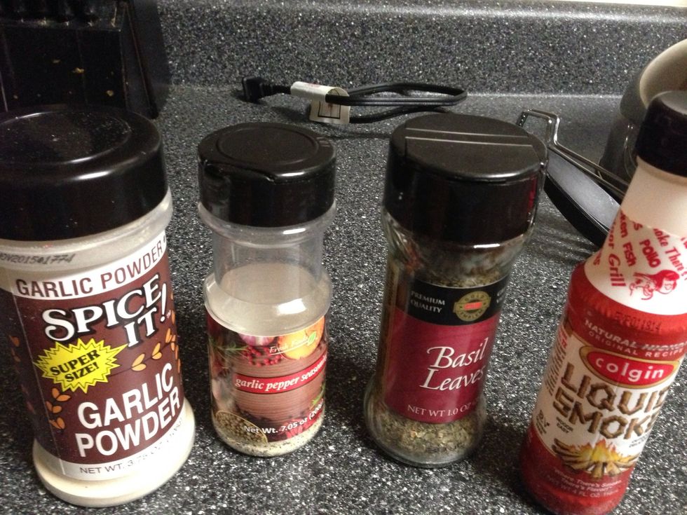Seasonings. I don't measure, I shake :). The liquid smoke gives the meat that grilled, smoked taste. Notice I'm not using salt. The garlic pepper has salt in it.