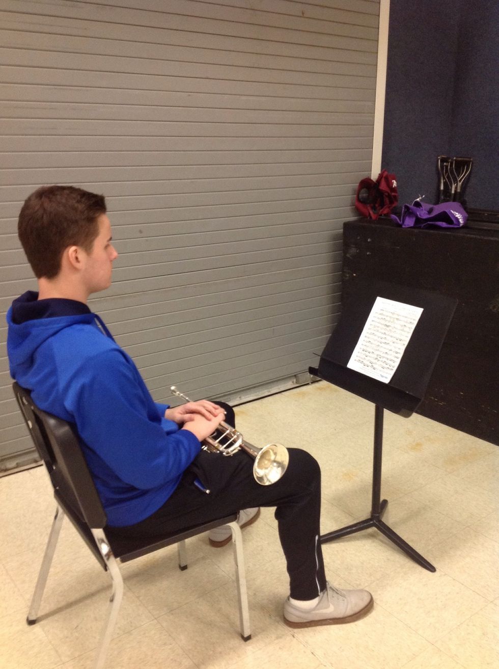 Seat yourself with your piece of music and your instrument.