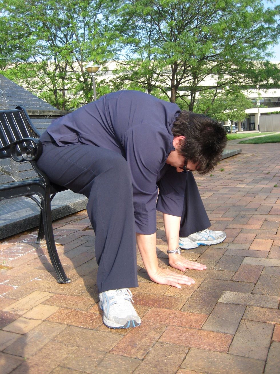 Seated forward fold \u2013 feet planted, knees bent, hands on table or hips, lead w/heart