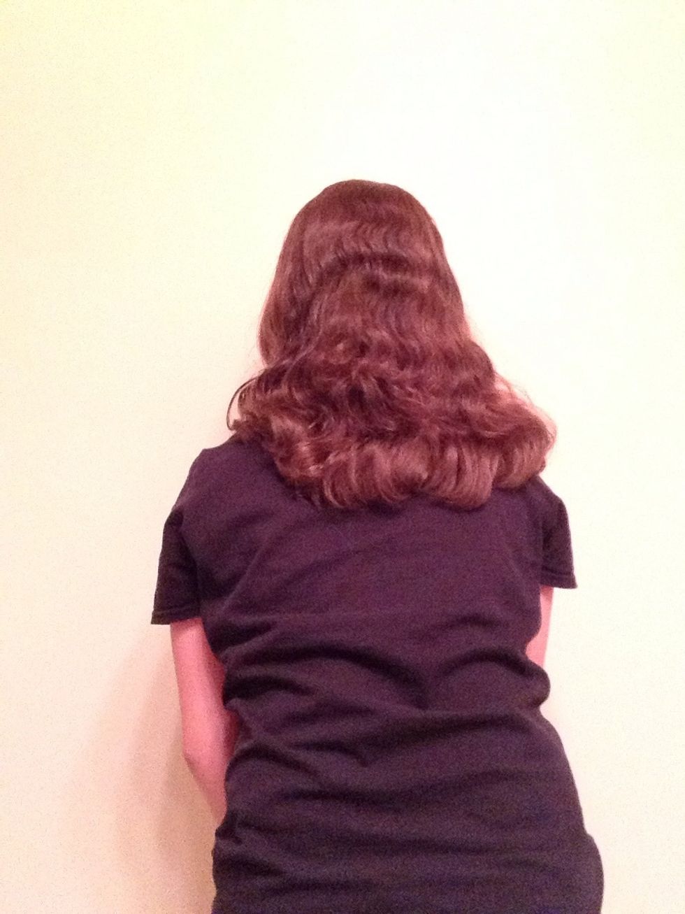 Second, brush your hair out and lightly dampen it with water. Do this technique before bed for the best results.