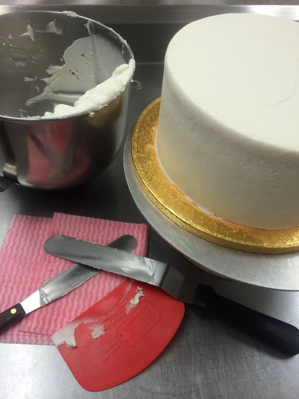 Second coat of frosting is applied. Making it smooth and crumb free. Set aside, let's work on the fondant.