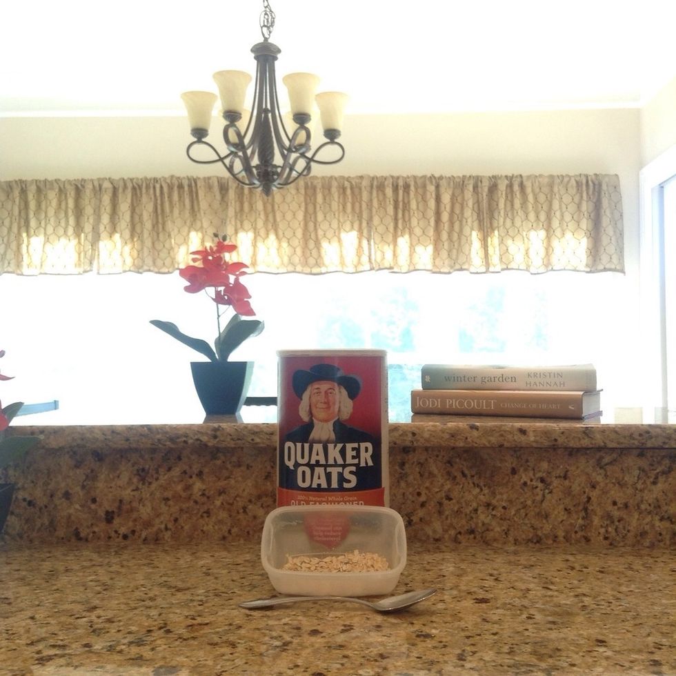 Second, pour one tablespoon of your choice of oatmeal into the container.
