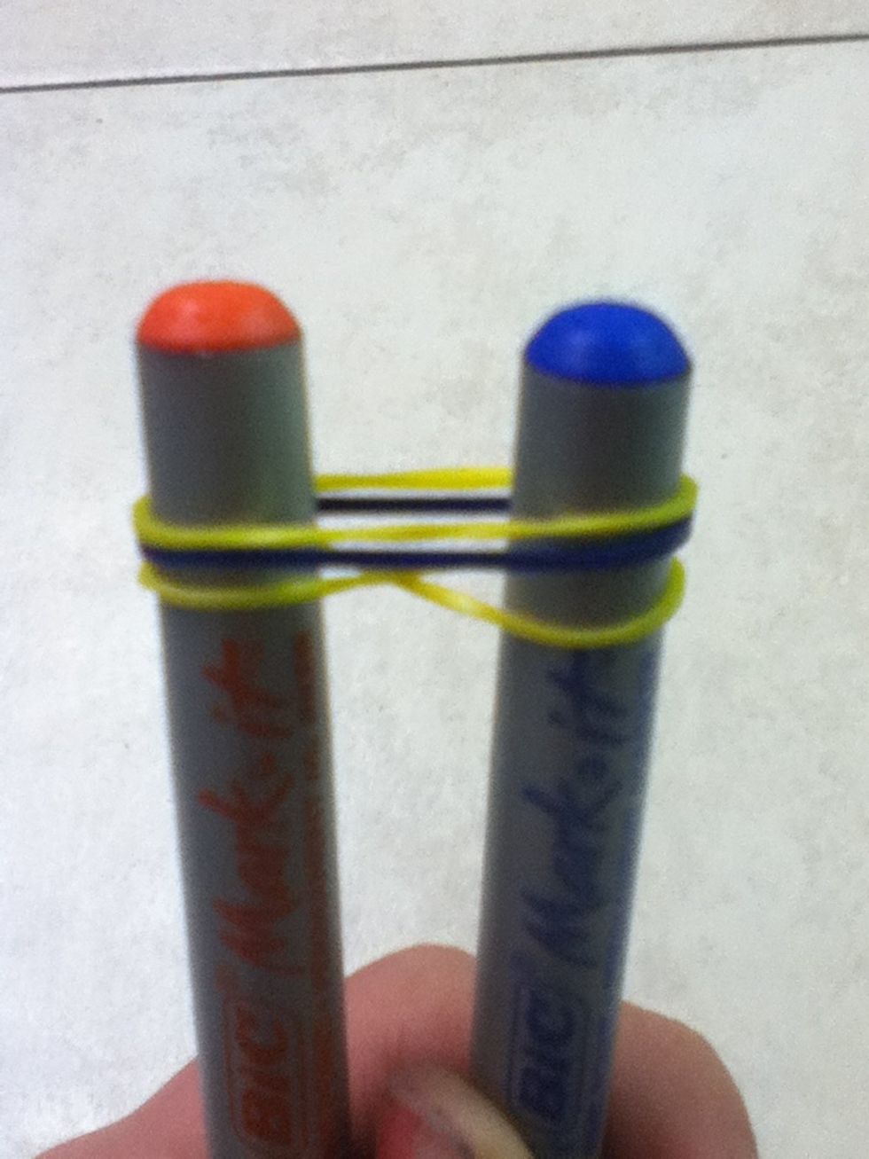 Second, put the next 2 ruberbands on but don't twist them