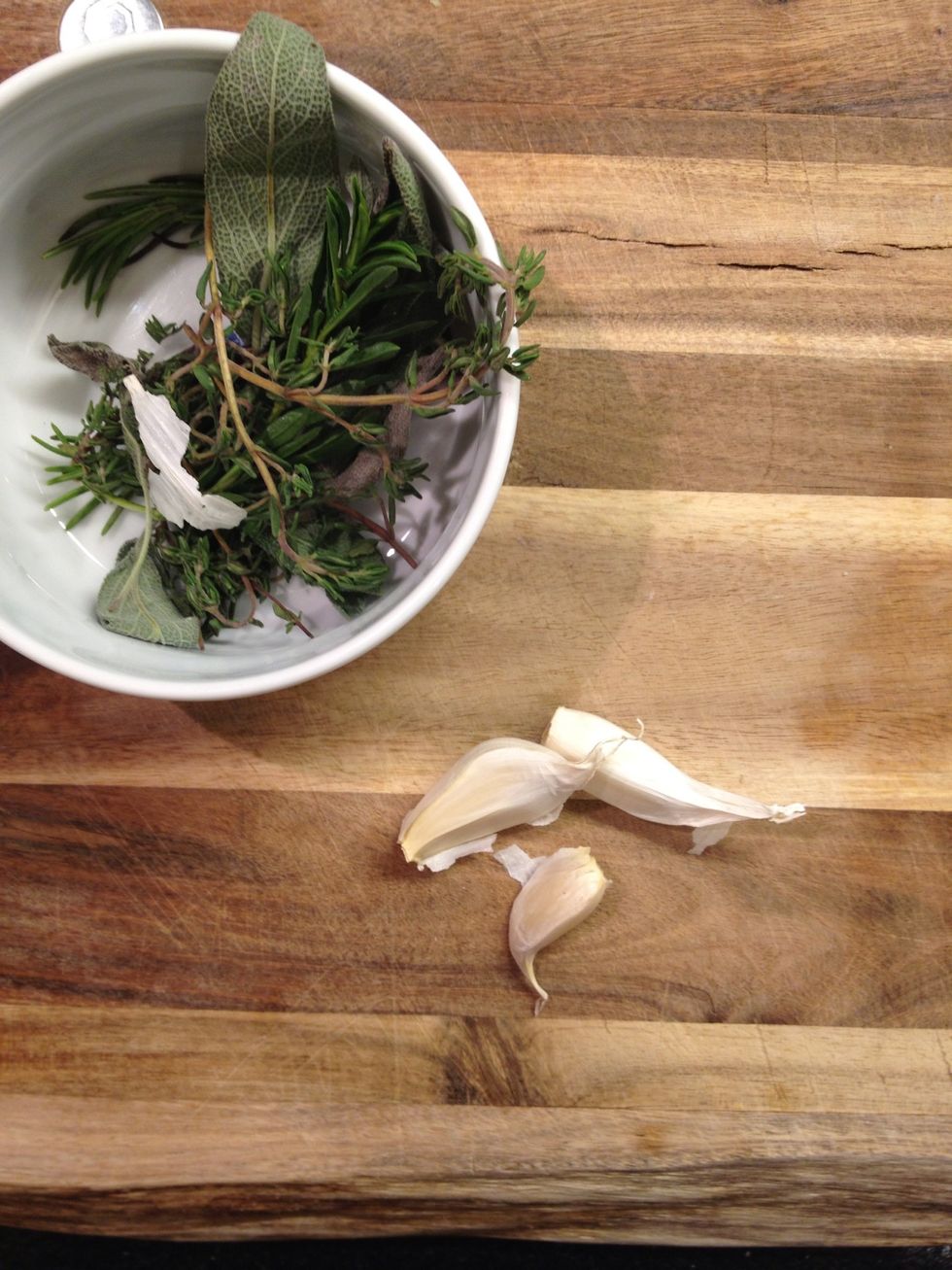 Second round of herbs and garlic. Crush the garlic.
