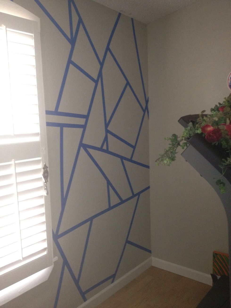 Second stage of applying painters tape (on other side of window).