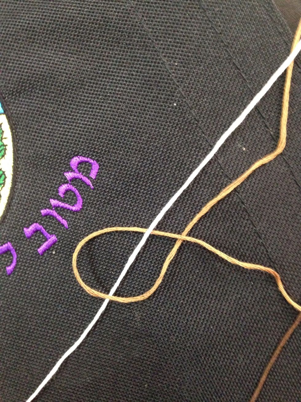 Second tie to the right. Remember to continue the first three rows in an organized and spread out manner.