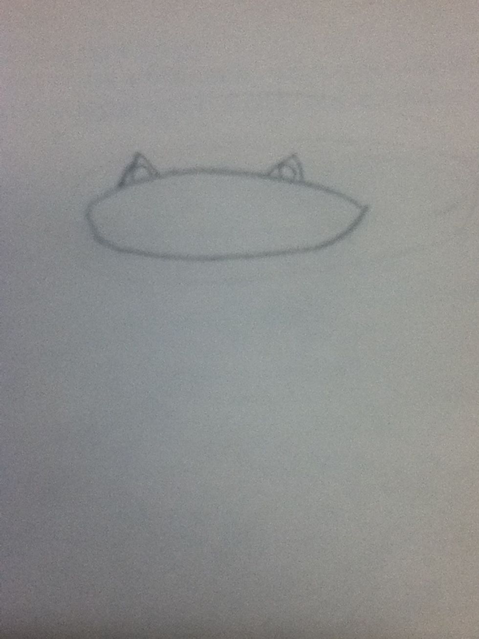 Secondly, draw an oval and two triangles on top of the oval.